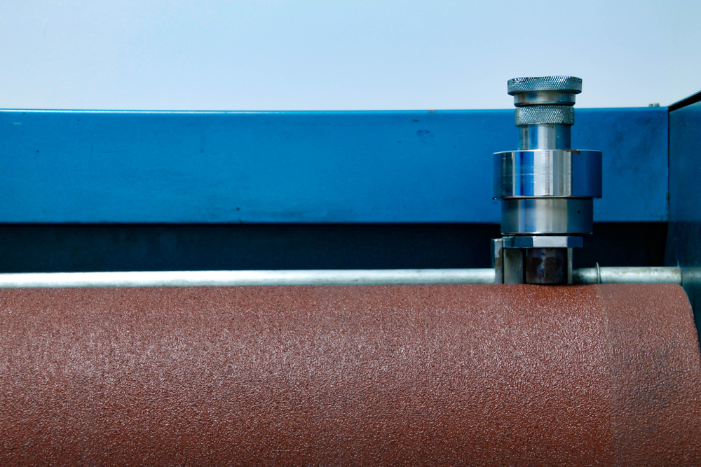 Taber abrasion tester evaluating coating durability on an automotive panel in the ISO/IEC 17025-accredited lab at GPTesting in Harper Woods, Michigan